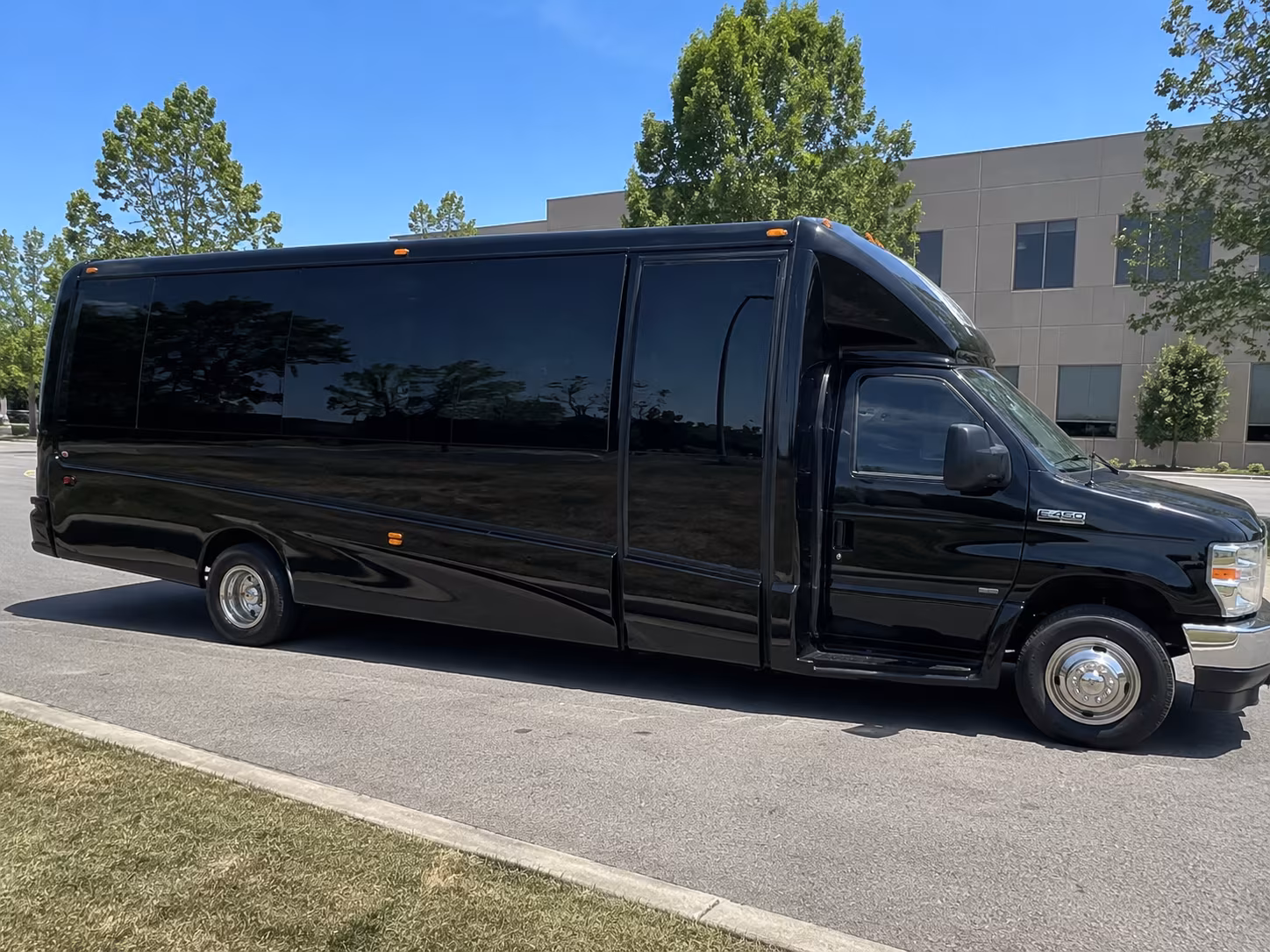 Group beside a Mercedes Sprinter limo in San Antonio